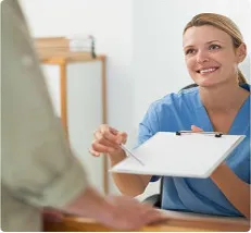 A healthcare professional having a conversation with a patient.